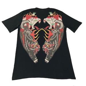 May include: Black t-shirt with a graphic print of two black panthers with red and yellow flames on a black background.
