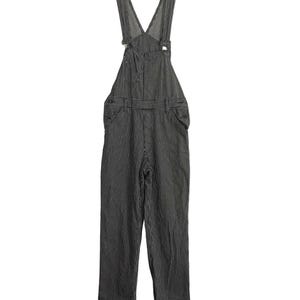 May include: Black and white striped dungarees with adjustable straps. The dungarees have a V-neck and two front pockets.