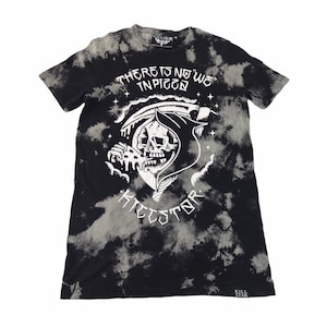 May include: Black and white tie-dye t-shirt with a graphic of a skeleton wearing a hooded robe and eating a slice of pizza. The text "THERE IS NO WE IN PIZZA" is above the graphic and the text "KILLSTAR" is below the graphic.