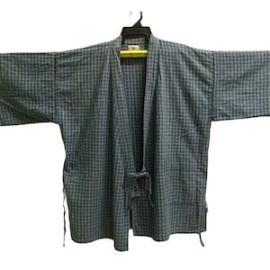 May include: A blue and white checkered kimono with a long sleeve and a tie closure.