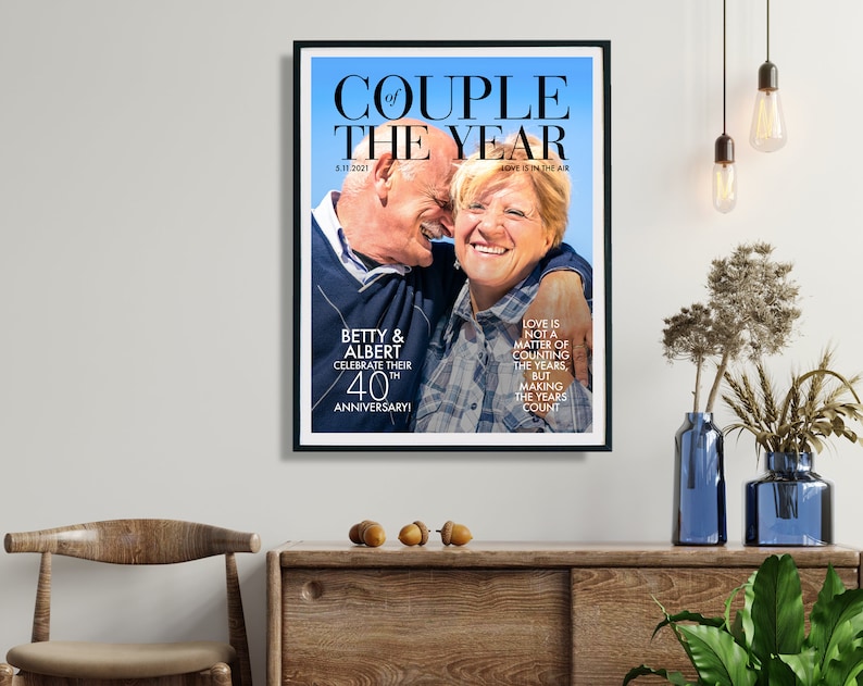 May include: A magazine cover with a photo of an older couple celebrating their 40th anniversary. The headline reads "Couple of the Year" with the text "Love is not a matter of counting the years, but making the years count".