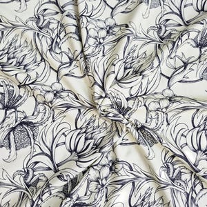 Organic cotton jersey fabric ‘Oda’ beige and dark blue GOTS certified