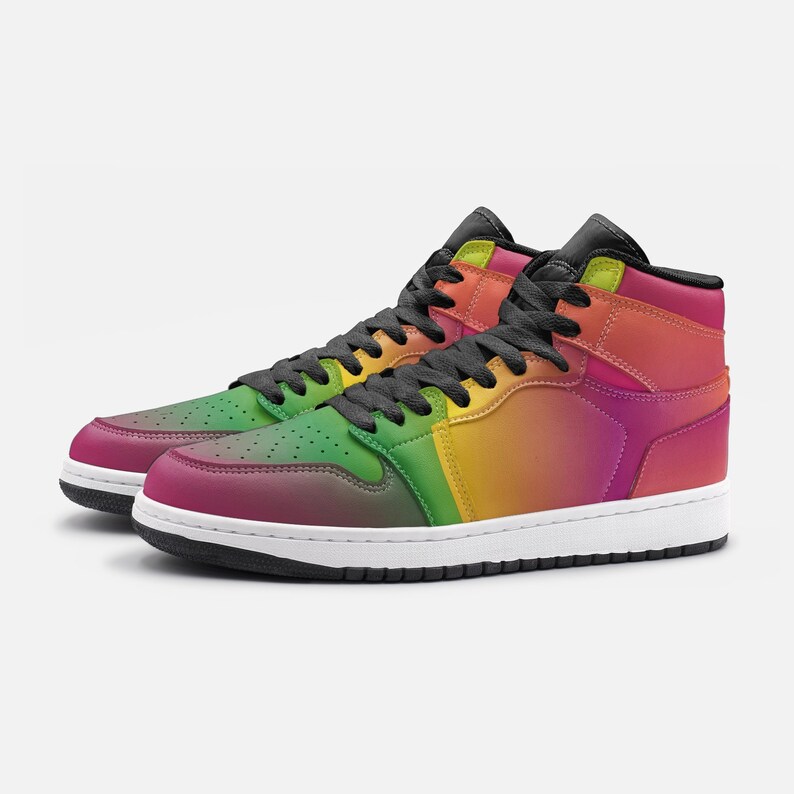 May include: A pair of high-top sneakers with a vibrant rainbow gradient design. The shoes feature a color scheme that transitions from green to yellow to orange to pink. They have black laces, a black tongue, and a white sole.