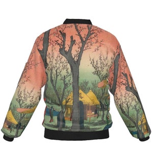 May include: A bomber jacket featuring a Japanese landscape design. The jacket has a black collar, cuffs, and hem. The artwork depicts trees, buildings, and figures in shades of green, orange, and black.