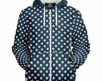May include: Navy blue zip-up hoodie with a white star pattern. The hoodie has a white interior lining, a drawstring hood, and two front pockets. The zipper is white, and the overall design is reminiscent of the American flag.