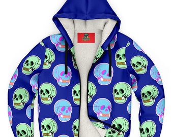 May include: A blue zip-up hoodie with a repeating pattern of cartoon skulls in shades of green and blue. The skulls have pink accents and gold teeth. The interior is lined with white fleece. The hood is a solid blue color.