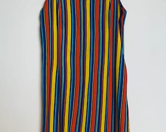 May include: A sleeveless dress with a square neckline and a colorful striped pattern. The stripes are red, yellow, blue, and orange.