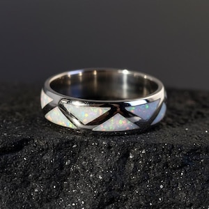 May include: A set of three ceramic mugs with a speckled, matte finish. The mugs are in shades of cream, light gray, and dark gray. Each mug has a simple, minimalist design, perfect for coffee or tea.