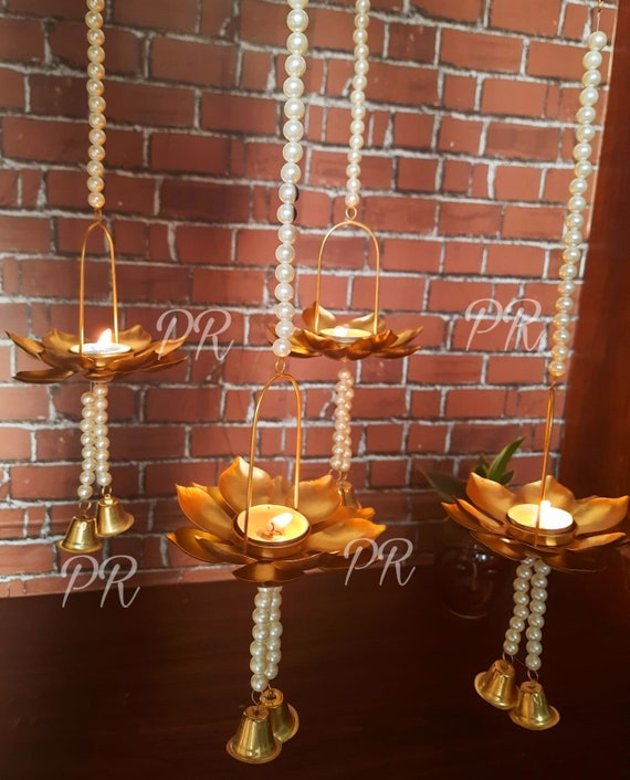 Tea light holder wall hanging outlet