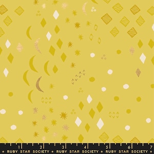 May include: A yellow fabric with a repeating pattern of gold moons, stars, and diamonds. The fabric has a subtle shimmer and is perfect for crafting projects.