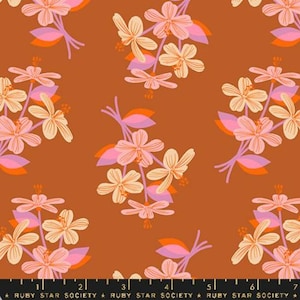 May include: A brown fabric with a repeating pattern of pink, orange, and yellow flowers. The flowers are stylized and have a retro feel.