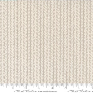May include: A white fabric with a repeating pattern of small grey arrows. The fabric is measured with a ruler in inches.