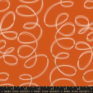May include: Orange fabric with a repeating pattern of white, swirling lines. The fabric has a ruler along the bottom edge with the text "RUBY STAR SOCIETY" printed on it.
