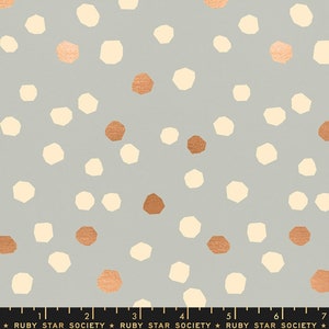May include: A seamless pattern featuring a repeating design of irregular, geometric shapes in shades of cream and copper on a light gray background.