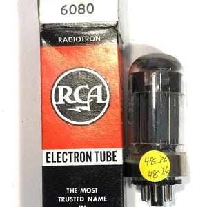 May include: An RCA 6080 Electron Tube in its original box. The box is red and black with the RCA logo and the words "RADIOTRON" and "ELECTRON TUBE". The tube is clear with internal components and a yellow sticker.