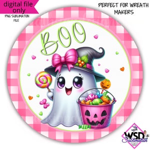 May include: A pink and white checkered circle with a cute cartoon ghost wearing a witch hat and holding a lollipop and a bucket of candy. The ghost has big eyes and a big smile. The text "BOO" is written in green letters on the circle.