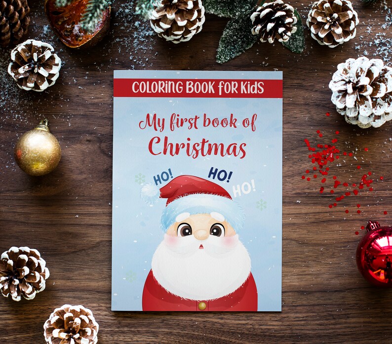 Peut inclure: Un livre de coloriage bleu avec un P&egrave;re No&euml;l en dessin anim&eacute; sur la couverture. Le livre est intitul&eacute; "Mon premier livre de No&euml;l" et contient les mots "HO!" r&eacute;p&eacute;t&eacute;s trois fois.