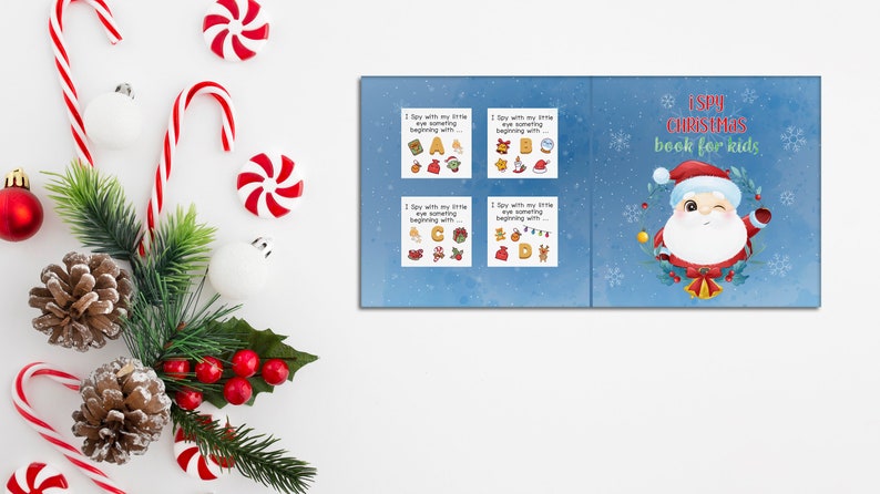 Peut inclure: Un livre bleu et blanc intitul&eacute; "I Spy Christmas Book for Kids". La couverture pr&eacute;sente un P&egrave;re No&euml;l de dessin anim&eacute; avec une couronne de houx et des cloches.