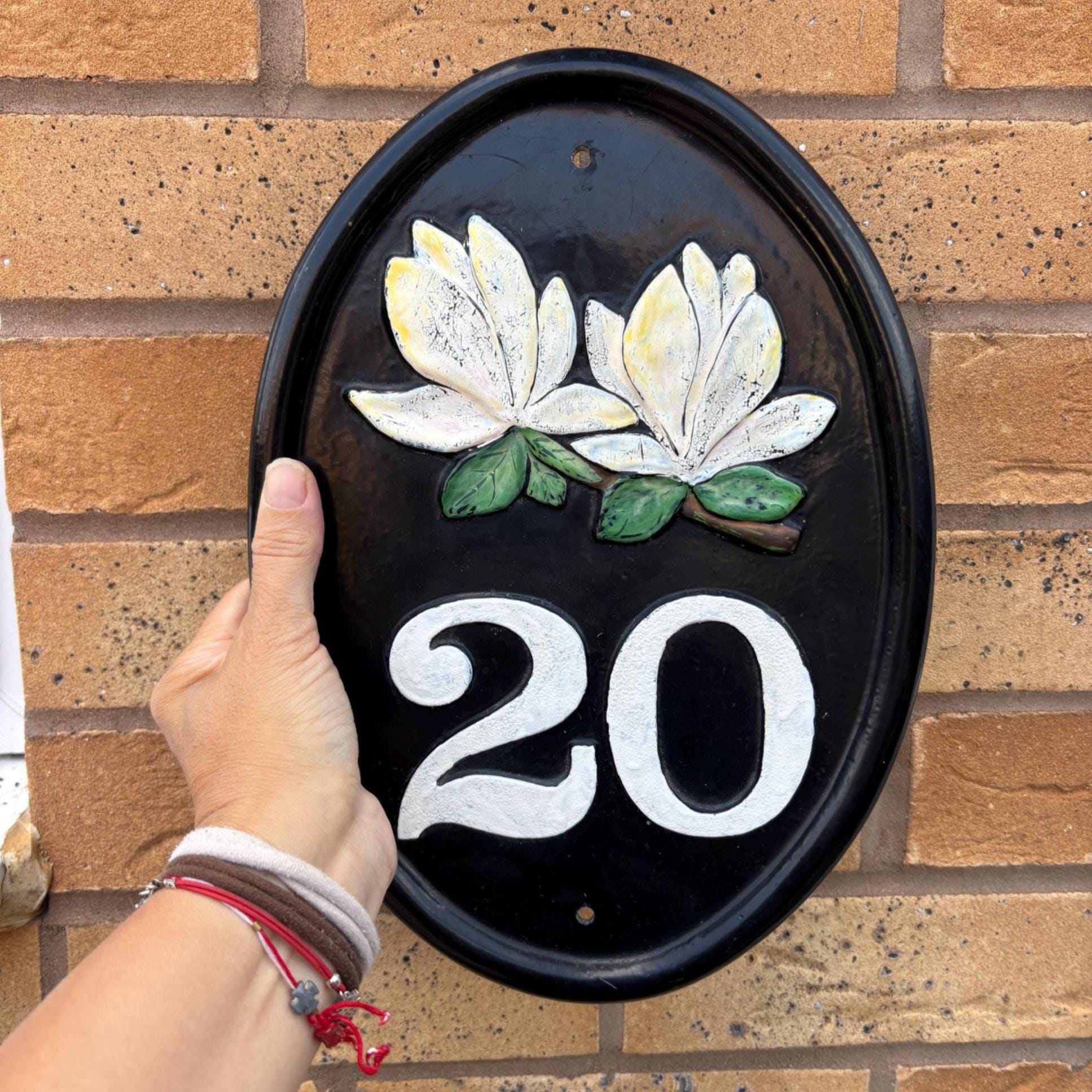 Cast Iron House Number Plaque: Black Oval Sign with White Magnolias