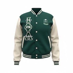 May include: A green and cream varsity jacket with white accents. The jacket features the Greek letters Phi, Iota, and Lambda, along with a crest on the chest. The jacket has a button-up front and striped cuffs and hem.