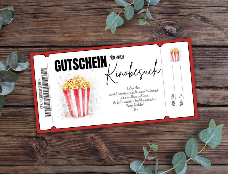 May include: Red and white gift certificate for a movie outing. The certificate features a drawing of a bucket of popcorn and the text "GUTSCHEIN F&Uuml;R EINEN Kinobesuch".