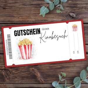 May include: Red and white gift certificate with the text "Gutschein f&uuml;r einen Kinobesuch" which translates to "Gift certificate for a movie visit". The certificate features a cartoon image of a bucket of popcorn.