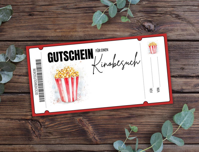 May include: Red and white gift certificate with the text "Gutschein f&uuml;r einen Kinobesuch" which translates to "Gift certificate for a movie visit". The certificate features a cartoon image of a bucket of popcorn.