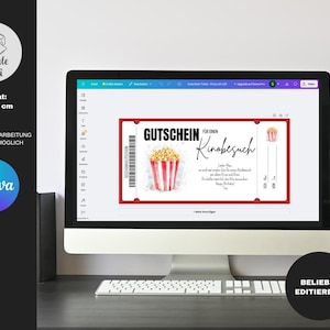 May include: A red and white printable gift certificate for a movie outing. The certificate features a watercolor illustration of a bucket of popcorn. The text on the certificate reads "Gutschein f&uuml;r einen Kinobesuch".