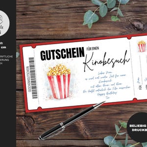 May include: A red and white printable gift certificate for a movie outing. The certificate features a watercolor illustration of a bucket of popcorn. The text on the certificate reads "Gutschein f&uuml;r einen Kinobesuch".