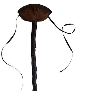 May include: A decorative witch's broom with a brown bristle head and a black handle. The broom features a black bow at the base and black ribbons extending from the top. The design is set against a white background.