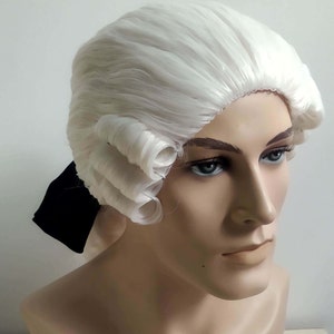 May include: A white wig with a long, straight style and curled sides. The wig is worn on a mannequin head.