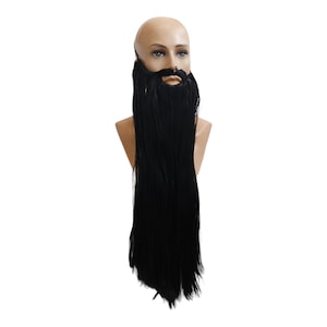 May include: A long, black, fake beard on a mannequin head. The beard is made of synthetic hair and is attached to the head with a strap.