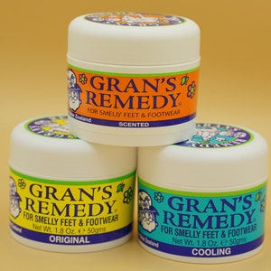 May include: Three small white jars of Gran's Remedy foot cream. The jars are labeled with the product name, 'Gran's Remedy', and the scent: 'Scented', 'Original', and 'Cooling'.