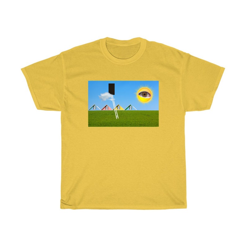May include: Mustard yellow t-shirt with a surreal graphic. The graphic features a green field, blue sky, and a ladder leading to a black rectangle. A sun with an eye and colorful triangles complete the design.