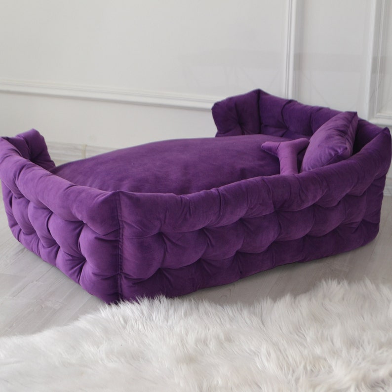 Purple handmade dog bed. Premium velor upholstery with claw protection. Filler - hypoallergenic holofiber. The pillow has a pillowcase that can be removed and washed. The gift comes with a pillow and a pillow in the form of a bone