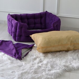 Purple handmade dog bed. Premium velor upholstery with claw protection. Filler - hypoallergenic holofiber. The pillow has a pillowcase that can be removed and washed. The gift comes with a pillow and a pillow in the form of a bone