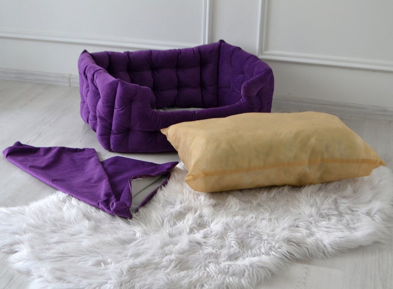 Purple handmade dog bed. Premium velor upholstery with claw protection. Filler - hypoallergenic holofiber. The pillow has a pillowcase that can be removed and washed. The gift comes with a pillow and a pillow in the form of a bone