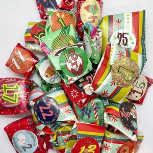 May include: A colorful advent calendar with small wrapped gifts numbered 1 through 25. Each gift is decorated with festive Christmas designs and patterns.