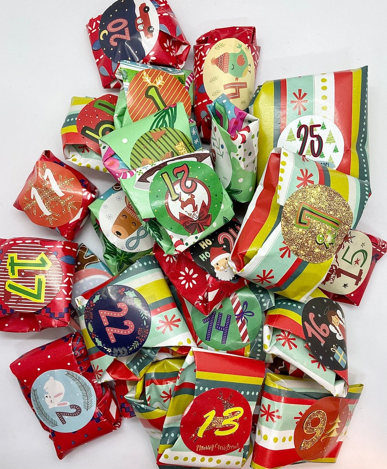 May include: A colorful advent calendar with small wrapped gifts numbered 1 through 25. Each gift is decorated with festive Christmas designs and patterns.