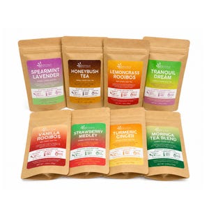 May include: Eight brown kraft paper pouches of Bathala Botanicals loose leaf tea arranged in two rows. Flavors include Spearmint Lavender, Honeybush Tea, Lemongrass Rooibos, Tranquil Dream, Vanilla Rooibos, Strawberry Medley, Turmeric Ginger, and Moringa Tea Blend.