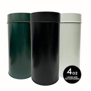 May include: Three cylindrical metal containers in green, black, and off-white. Each has a matching lid. A black circle with white text reads "4 oz LOOSE LEAF TIN CONTAINERS". These containers are designed for storing loose leaf tea.