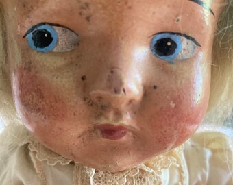 Tête de poupée en carton bouillie marque Paris yeux sulfure