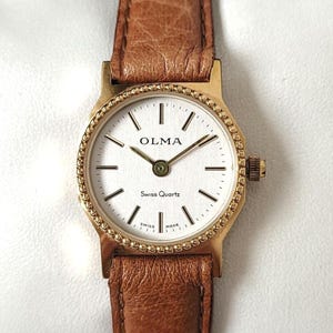 Reloj de cuarzo vintage Olma suizo de los años 90 ¡Único!