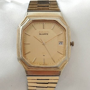 Reloj Seiko SQ dorado vintage de los años 80, todo original.