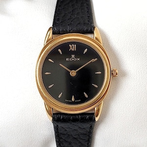 Edox vintage negro y dorado años 90, único