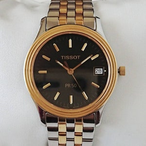 Tissot vintage negro y dorado de los años 90 sin usar