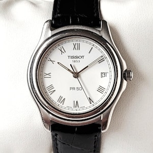 Vintage Tissot Classic met Romeinse cijfers in reliëf, jaren 90