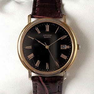 Reloj Citizen vintage negro y dorado de los años 90, único