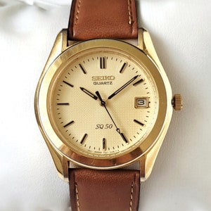 Reloj Seiko SQ vintage dorado de los años 90, único