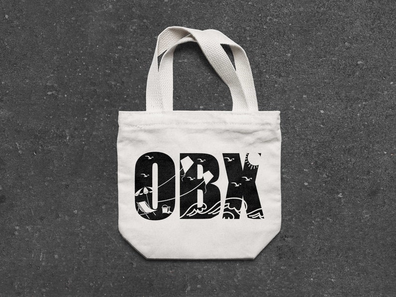 May include: White canvas tote bag with black text that says "OBX" with a beach scene design including an umbrella, beach chairs, and seagulls.